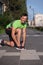 Young athlete, runner tie shoelaces in shoes