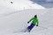 Young athlete skiing in Val Thorens french mountains on sunny day