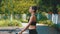 Young Athlete Woman in Comfortable Sport Outfit Jumping Rope on a Sports Field in the Park