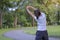 Young athlete woman streching in the park outdoor, female runner warm up ready for jogging on the road outside, asian Fitness walk