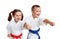 Young athletes in kimono beat a punch arm on a white background