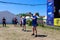 Young athletes performs exercises with dumbbells during ethno-rock festival Kozak Fest