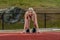 A Young Athletic College Athlete Prepares For A Track Meet At A University