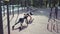 Young athletic couple doing exercises outdoors