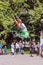 a young athletic girl jumps on jumpers in Gagarin`s Park on a summer sunny day