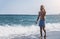 Young athletic man walking at the beach