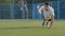 Young athletic Middle Eastern Indian sportsman runner or footballer in summer sportswear doing warm-up before training