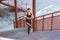 Young athletic slim beautiful woman running up stairs doing cardio interval training in black fashionable sportwear in the street