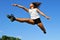 Young athletic woman in a long jump