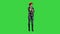 Young attractive asian engineer woman standing having a phone call on a Green Screen, Chroma Key
