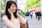 Young attractive asian tourist doing shopping in Paris