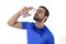 Young attractive and athletic sport man drinking water