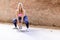 Young attractive blonde woman using a Kettlebell for crossfit weightlifting. Sporty female holding heavy weight for