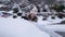 Young attractive brunette woman clearing snow off a car with a ice scraper in the winter. HD 24FPS.