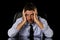 Young attractive businessman in worried tired and stressed face expression sitting depressed on office chair