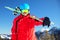 Young attractive caucasian skier with ski in Swiss Alps ready for skiing