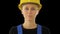 Young attractive caucasian woman builder in the hard yellow helmet, Alpha Channel