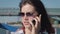 Young Attractive Caucasian Woman In Sunglasses Having Fun Talking On Phone