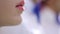 Young attractive cinema movie theater workers woman painting lips with lipstick men adjusting bow ties in close up shot