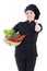 Young attractive cook woman in black uniform with vegetables thu