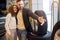 Young attractive couple choosing tyres for car