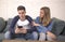 Young attractive couple in relationship problem with internet mobile phone addiction boyfriend ignoring sad neglected and bored gi