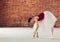 Young attractive dancer having fun in the studio