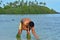 Young attractive and exotic Polynesian Cook Islander man bathing