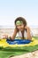 Young attractive girl on beach with Brazil flag