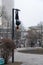 Young attractive Girl hanging by feet upside down on the street light in the street. super extreem. concept of courage