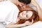 Young attractive happy amorous couple at bedroom