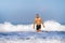 Young attractive and happy man with beard and swimming trunks at tropical paradise desert beach alone playful and cheerful in sea