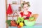 Young attractive housewife with vegetables