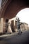 Young attractive Indian couple dancing under brick archway