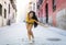 Young attractive latin woman happy and excited posing on modern urban European city