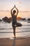 Young attractive latin woman wearing a bikini practicing yoga on the beach at sunset, healthy lifestyle concept