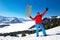 Young attractive man ready to go sledding in Swiss Alps during winter vacation