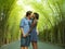 Young attractive mixed ethnicity couple kissing outdoors with attractive black afro American woman and handsome Caucasian