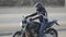 Young attractive motorcyclist with black helmet on street. Man motorcycle biker