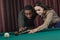 young attractive multiethnic man and woman playing in pool
