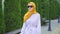 Young attractive muslim woman visually impaired with a walking cane in the park close up