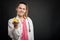 Young attractive pediatrician doctor holding yellow toy duck