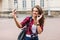 Young attractive playful tourist is making selfie on the phone o