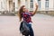 Young attractive playful tourist is making selfie on the phone outside wearing hat sunglasses