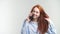 Young Attractive Redhead Girl Talking By Phone With Friend And Smiling.