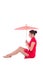 young attractive sitting woman in red japanese dress with umbrella isolated on white