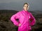 Young attractive sport woman in running jacket posing with attitude defiant cool