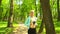 Young, attractive and sporty blond girl jogging outdoor in the park. Healthcare, sport, fitness and lifestyle.