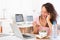 Young attractive student eating salad while phoning