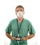 Young attractive and successful medicine doctor or nurse man posing confident  in green medical uniform and face mask standing